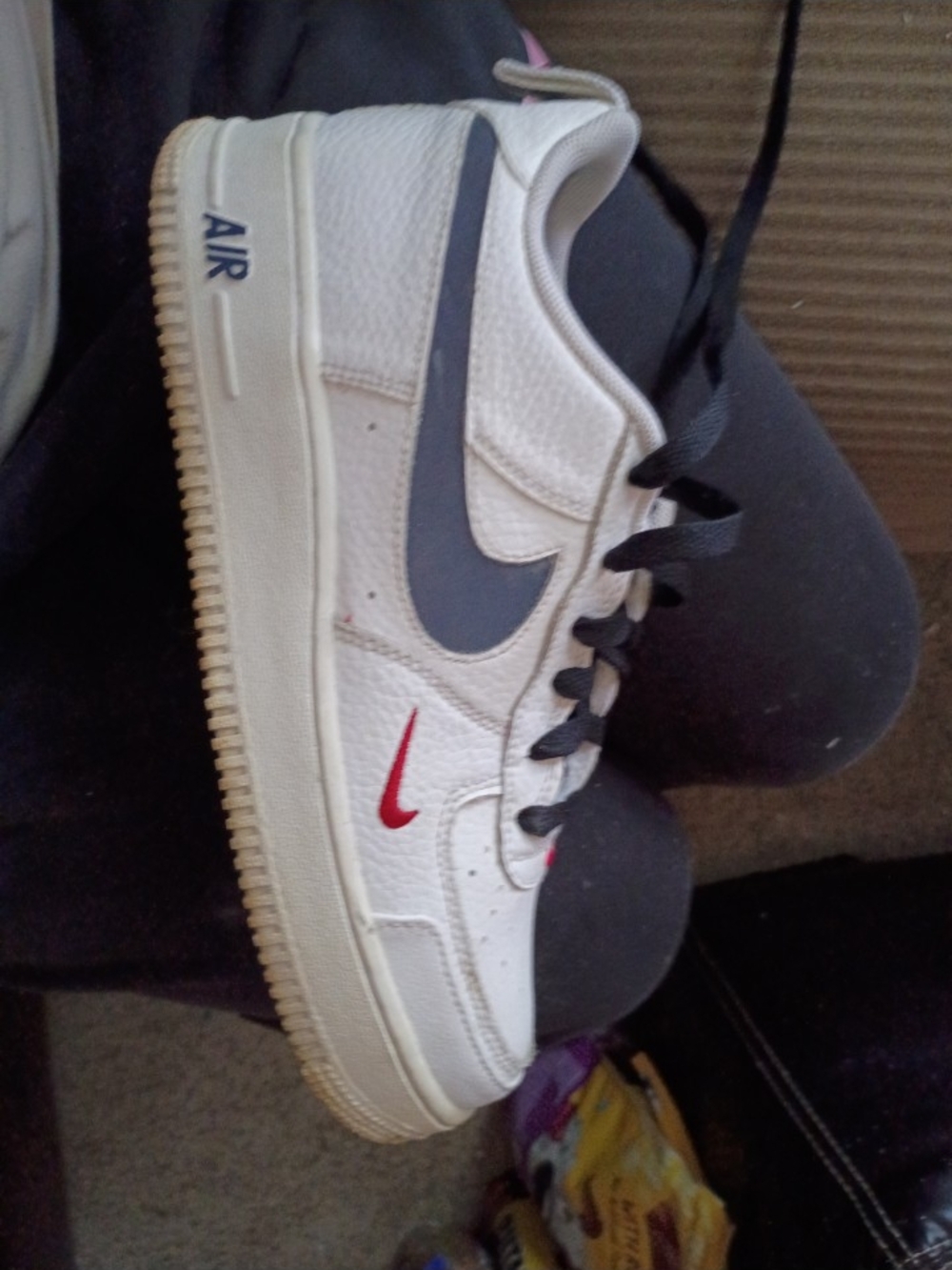 Nike White Low-Top Sneakers with Blue and Red Swooshes